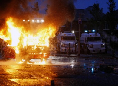 A stolen car explodes as police clash with Nationalist protesters in the Ardoyne Road area of north Belfast on Monday, 12 July, 2010.
