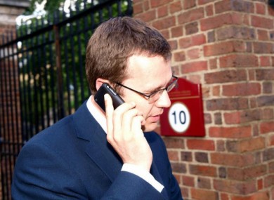 Andy Coulson, one of Cameron's senior aides, on the phone in July, 2010.