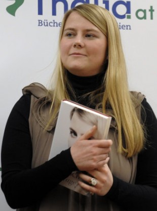 Natascha Kampusch poses with her book
