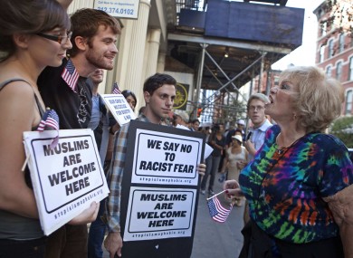 Linda Jacknow (70) of Long Island, an opponent of the proposed mosque, argues against Aviva Stampfer (21) and Blake Luley (23) in New York yesterday.