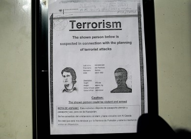 A wanted poster for German citizen Jan Pawlowic Schneider is seen on a door inside the military camp at Kabul airport,