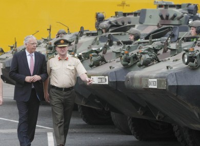 Lieutenant General Sean McCann (right) examines Army equipment returned from Chad with defence minister Tony Killeen (left).