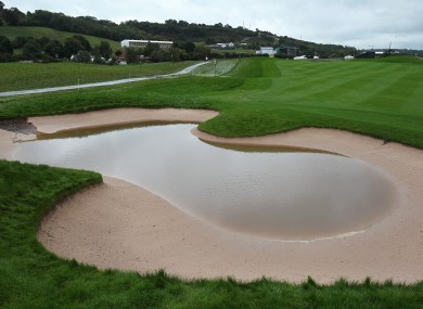 Rain water sits in a bunker on the 2nd hole at Celtic Manor.
