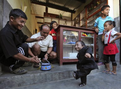 Khagendra Thapa Magar (right) has officially been declared the world's smallest man.