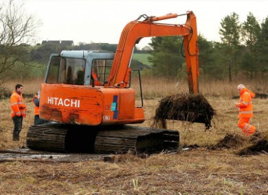 File photo dated 09/11/09 of members of the Independent Commission for the Location of Victims Remains searching for the body of Gerard Evans at Carrickrobin in County Louth.