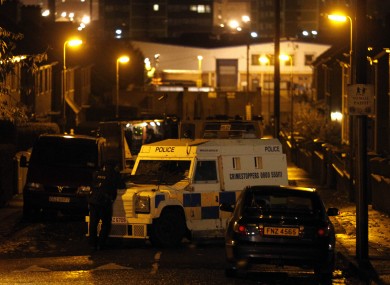 Police at the site of St James Park in West Belfast after a pipe bomb detonated there last night.