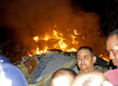 Flames shoot from the wreckage of the plane that crashed in Cuba, killing all 68 people on board.