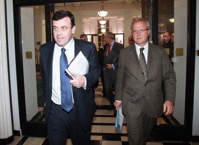 Brian Lenihan and Olli Rehn leave the Department of Finance to address reporters outside last night's meeting.