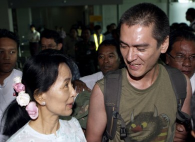 Myanmar's pro-democracy leader Aung San Suu Kyi welcomes her son Kim Aris, at Yangon International Airport today.