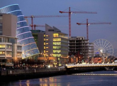 Cranes stand above the unfinished Anglo Irish Bank that was to be the their new headquarters in central Dublin, 23 November, 2010.