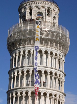 Italian students occupying the Leaning Tower of Pisa drape a banner reading 'No to Reform', protesting at proposals to rationalise university teaching.