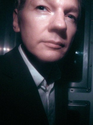 Julian Assange photographed in a police van on 14 December.