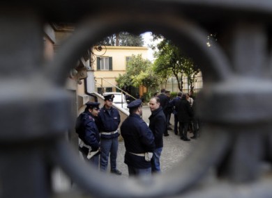 Police officers stand guard outside the Chilean embassy in Rome, the scene of a parcel bomb attack on 23 December, 2010.