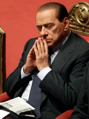 Italian Premier Silvio Berlusconi ponders after delivering his message at the Senate, in Rome, Monday, Dec. 13, 2010.