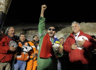 File photo of Luis Urzua (centre), the last of the 33 miners freed from the mine, on 13 October, 2010.