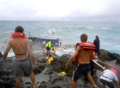 File image of people attempting to rescue people from the capsized vessel off the coast of Christmas Island on 15 December, 2010.