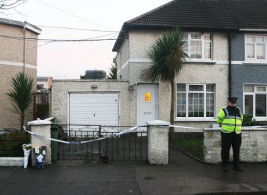A garda stands at the scene of Aidan O'Kane's shooting in December 2008.