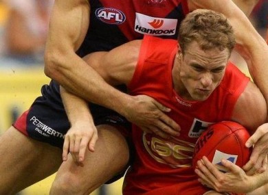 NAB Rising Star Brandon Matera (Gold Coast Suns) breaks a tackle.