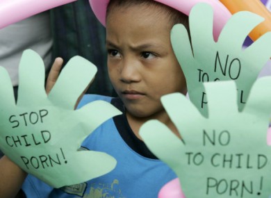 File photo of Filipino children show slogans during a rally as part of Universal Children's Day in Manila in 2008.