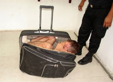 Photo taken Saturday showing Juan Ramirez Tijerina inside the suitcase.