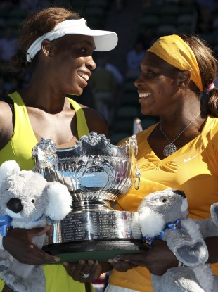 Venus and Serena Williams celebrate victory in the Women's Doubles at the 2010 Australian Open.