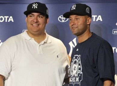 New York Yankees' Derek Jeter, right, with Christian Lopez.