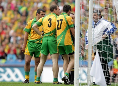 Donegal players surround the umpire last weekend.