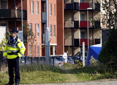 A Garda stands near the forensic tent covering the body of the shot man in Clongriffin today.
