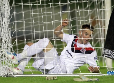 Bohemians' Aidan Downes tries to untangle himself from the net during last night's Premier Division game against UCD. UCD won 2-0.