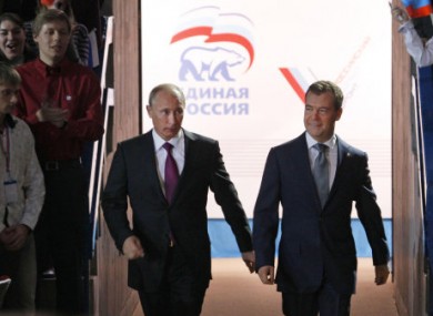 Putin and Medvedev arrive at the United Russia congress in Moscow.