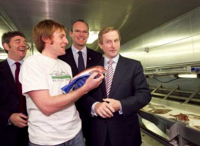 Marine Scientist Macdara O Cuaig shows Enda Kenny a fish on board the Celtic Explorer at the Dublin Docklands.