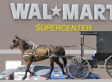 An Amish buggy drives away from a Wal-Mart store in Ohio.
