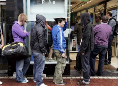 Customers line up to buy the iPhone 4 as it goes on sale in 2010.