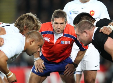Alain Rolland keeps a close eye on the France and New Zealand front rows.
