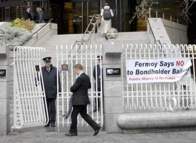 Bannerss outside the Central Bank calling for a halt to the bondholder payouts.