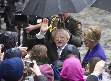 President Michael D Higgins and his wife Sabina say hello to the crowds that came out to greet them after the President's inauguration at Dublin Castle.