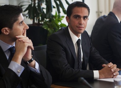 Alberto Contador and his lawyer Andy Ramos, left, wait for this morning's CAS hearing to begin.