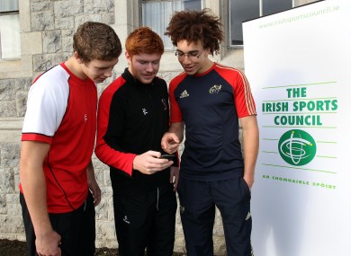 Matthew Rea, Conor Joyce and Ultan Dilhane check out the Irish Sports Council's Anti-Doping Android App at the U19 IRFU National Age Grade Talent Camp in Clongowes Wood College.