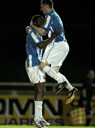 Monaghan United goalscorer Michael Isichei is congratulated by teammate Ryan Brennan.