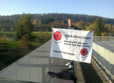 One member of the EDL on the FIFA building earlier today.