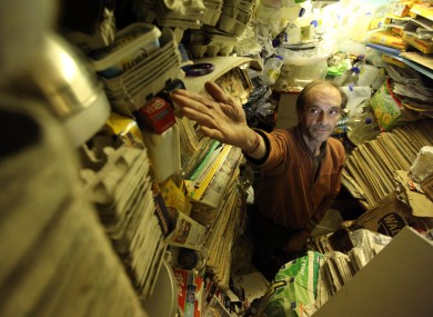 Richard Wallace eats and sleeps in a chair, because there is no space in his house for a bed.