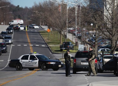 Police officers block a road on the Virginia Tech campus in Blacksburg, Virginia