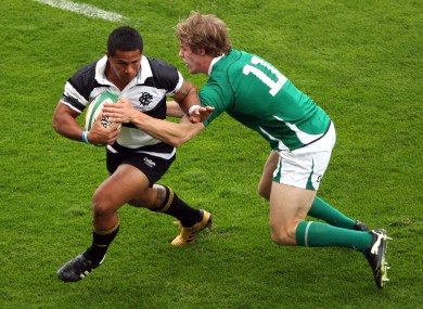 Ireland's Andrew Trimble tackles David Smith during last year's game at Thomond Park. The Barbarians won 29-23.