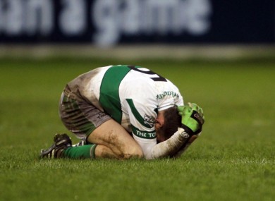 Portlaoise's Kieran Lillis struggles to come to terms with his side's defeat to St. Brigid's.