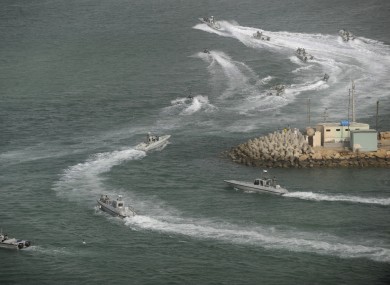 Iranian navy boats attend a drill in the sea of Oman on Friday.
