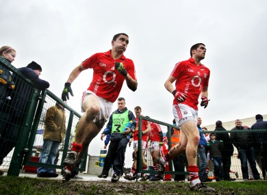 Cork's Kevin Harrington and Conor O'Driscoll take to the field in Clonmel yesterday.