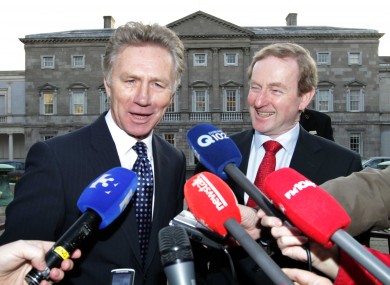 Eamonn Coghlan with Taoiseach Enda Kenny outside Leinster House today