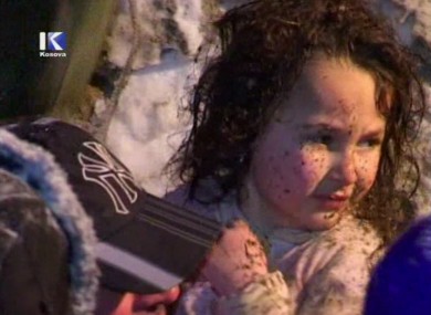 A TV still of the young girl after she was pulled from the rubble of an avalanche-struck house today.