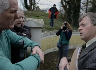 Ben Gilroy, from Freedom From All Debt, and Pat Dunne, the deputy sheriff, argue outside the home in Laois.