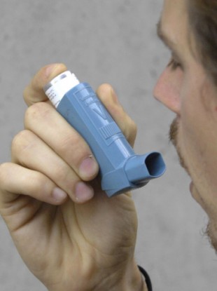 File photo of an asthma sufferer using an inhaler.